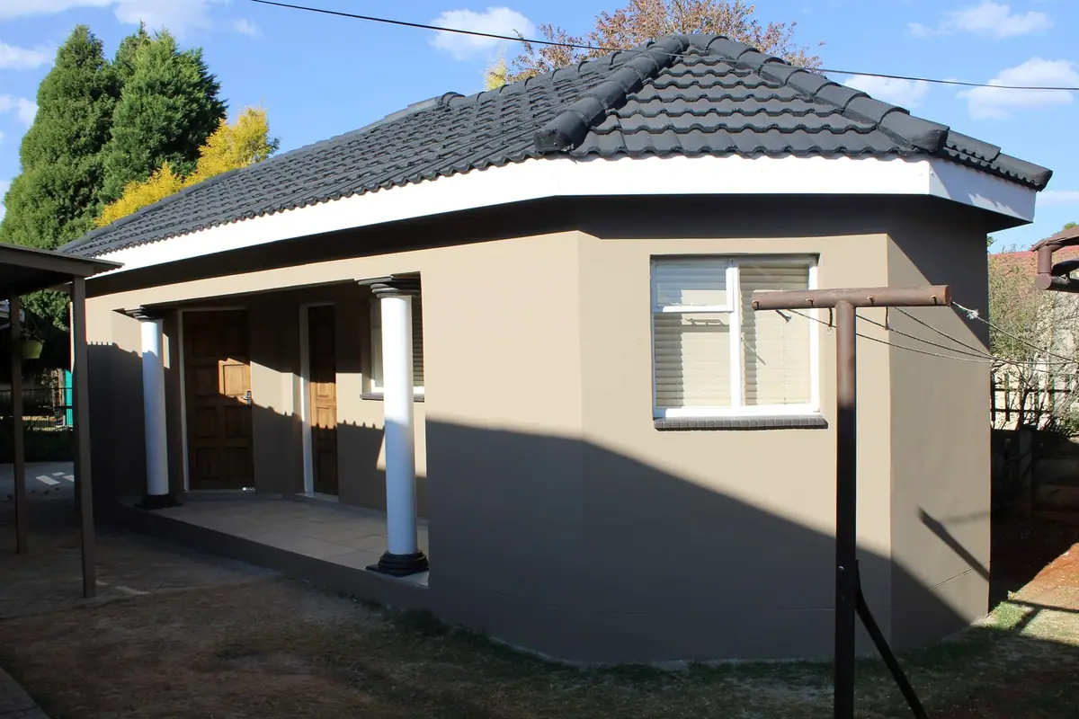 Room addition with a tiled hip roof