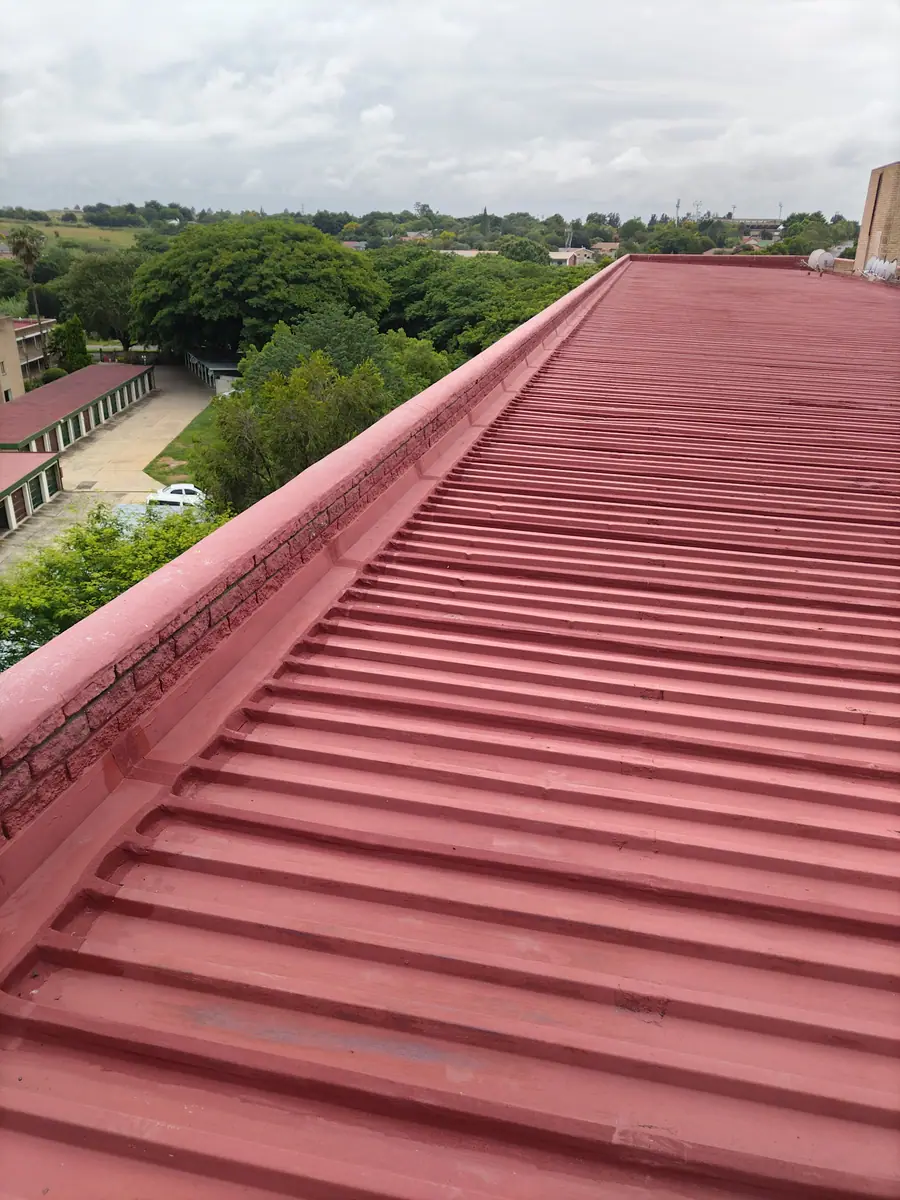 The same roof repaired and painted red